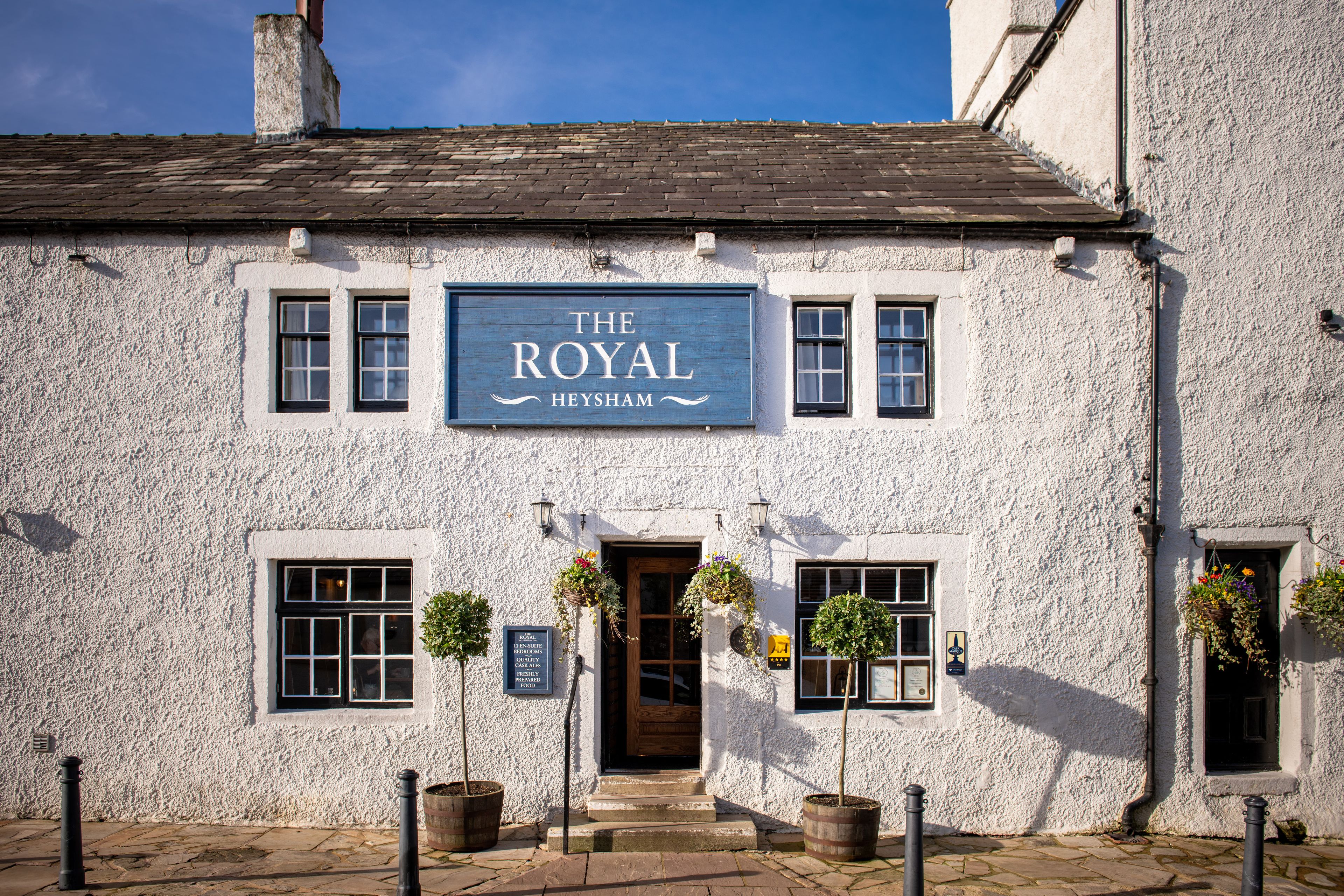 The Royal Heysham, a white pub with blue sign