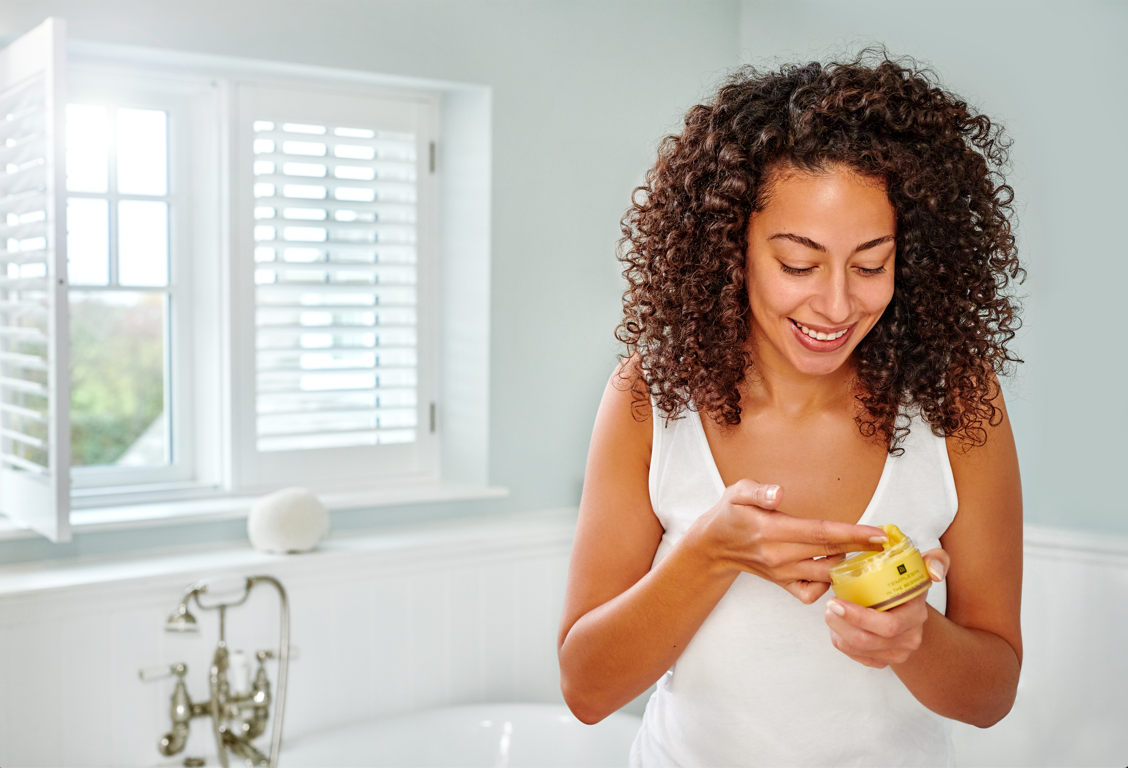 Woman uses temple spa product