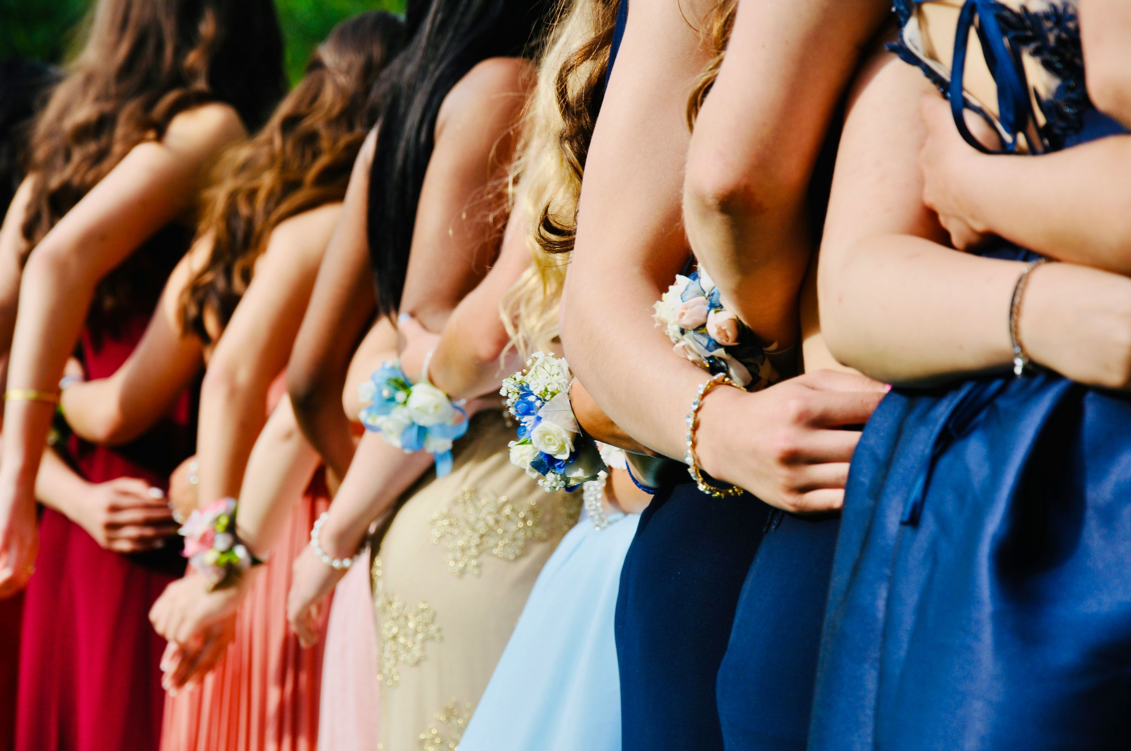 Back of prom girls taking a photo